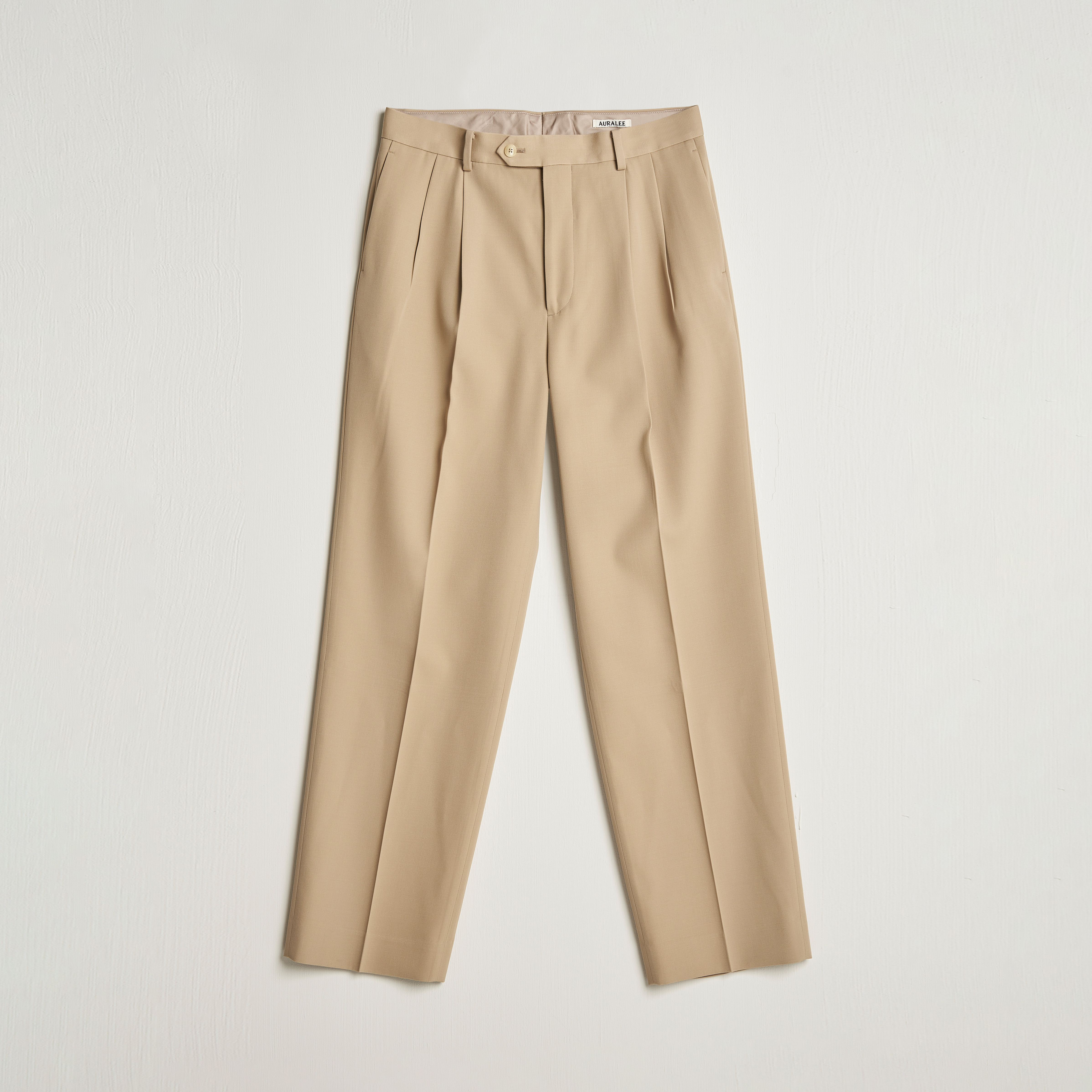 Auralee Wool Two Tuck Slacks Beige at CareOfCarl.com