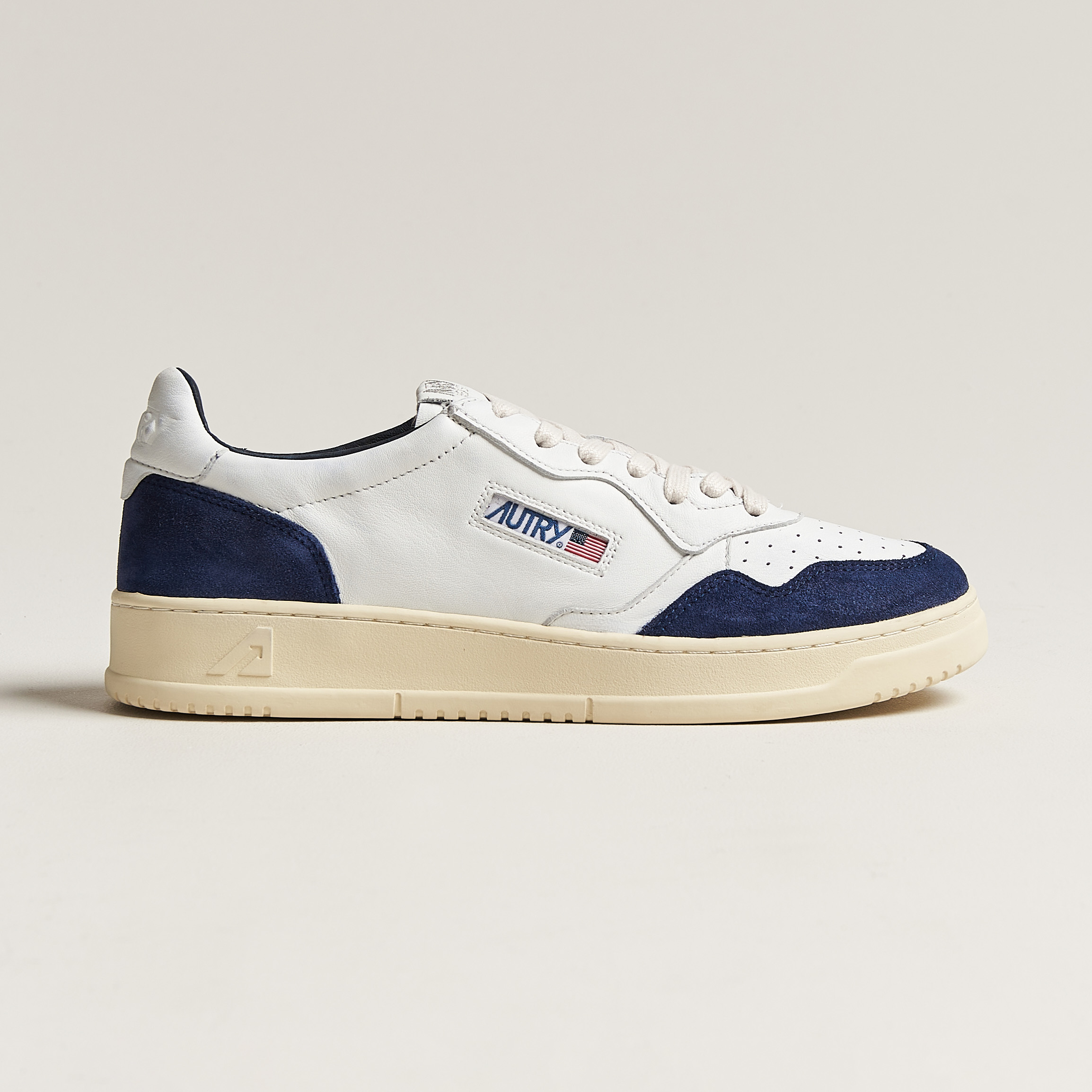 Autry Medalist Low Goat/Suede Sneaker White/Navy at CareOfCarl.com