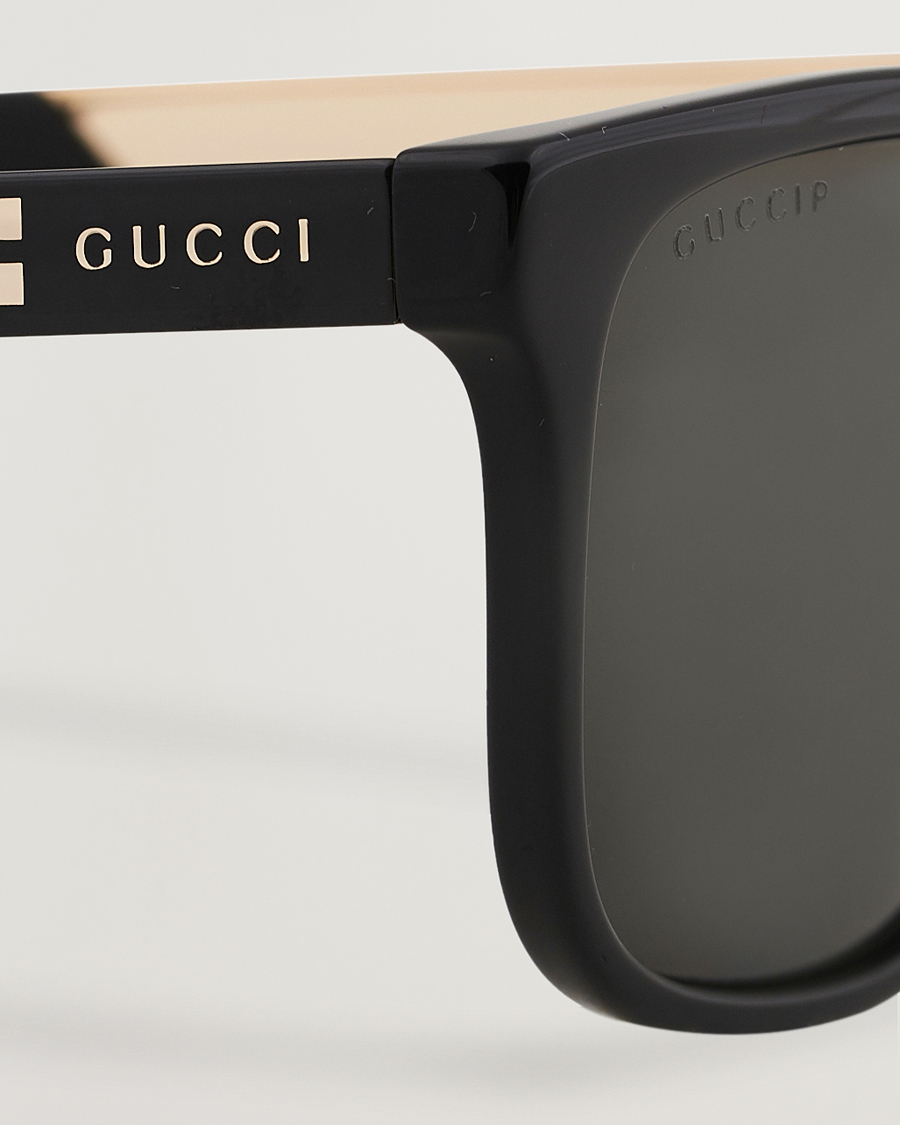 Gucci GG0687S Sunglasses Black at CareOfCarl.com