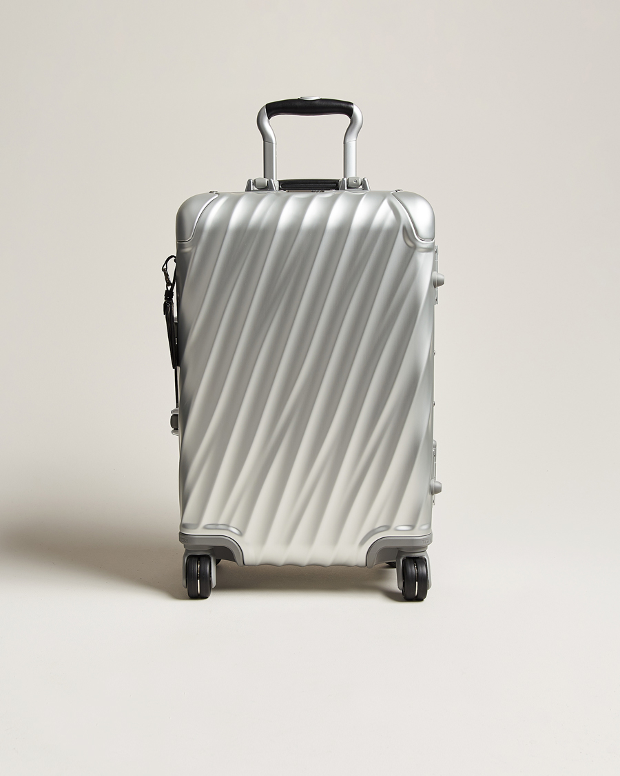 Tumi store silver suitcase