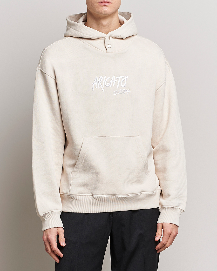 Axel Arigato Arigato Tag Hoodie Pale Beige at CareOfCarl