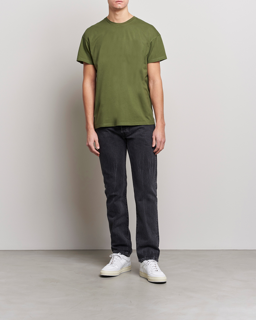 olive green t shirt with jeans