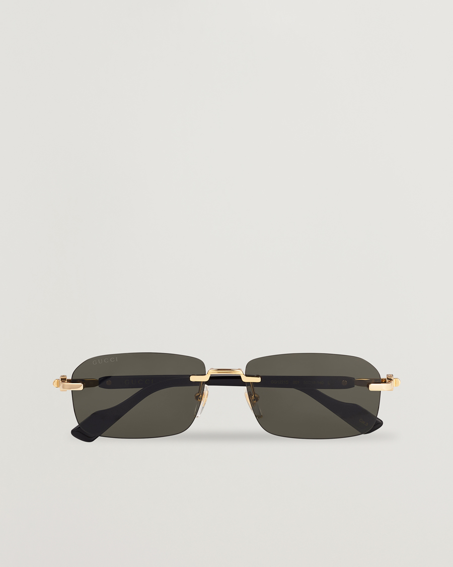 Gucci black sales gold sunglasses