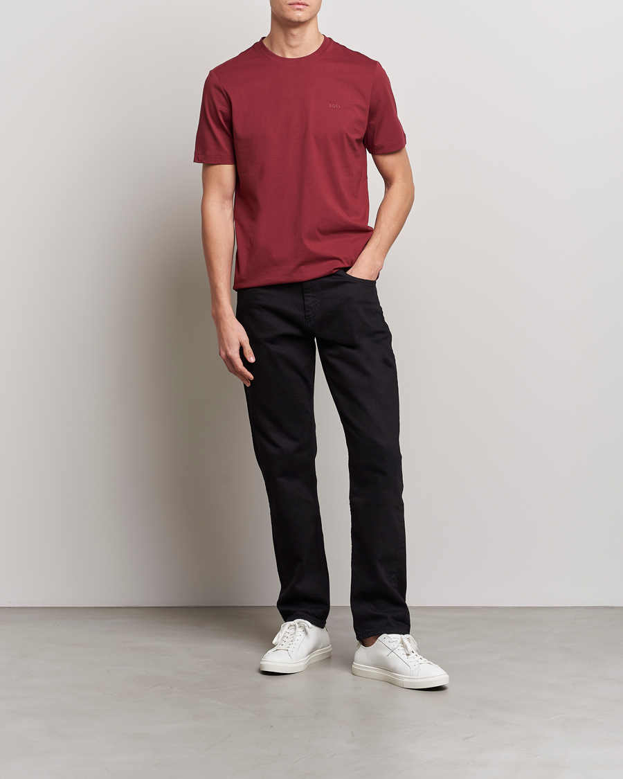 Red t store shirt black jeans