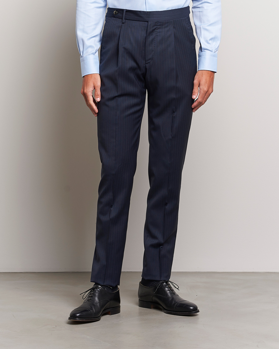 PT01 Slim Fit Pleated Wool Trousers Navy Pin at CareOfCarl.com