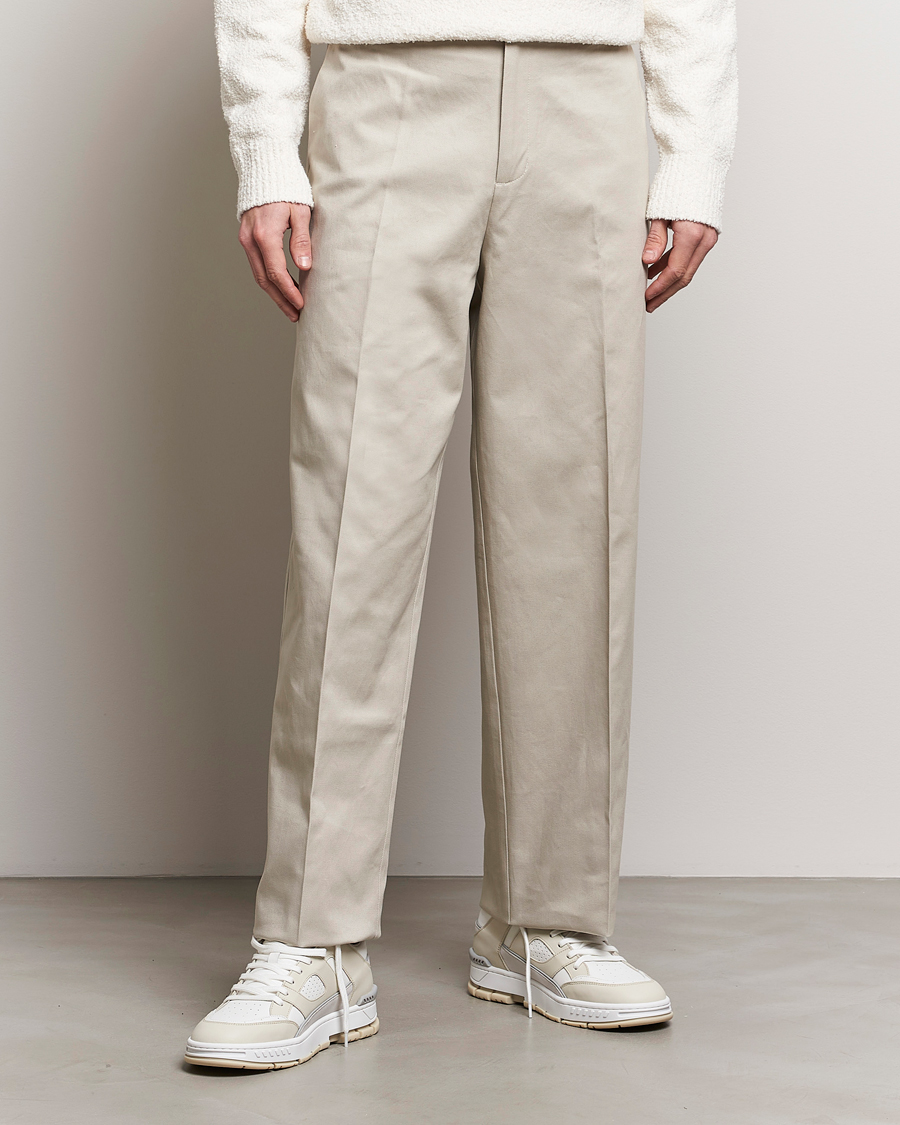 Axel Arigato Serif Relaxed Fit Trousers Pale Beige at CareOfCarl